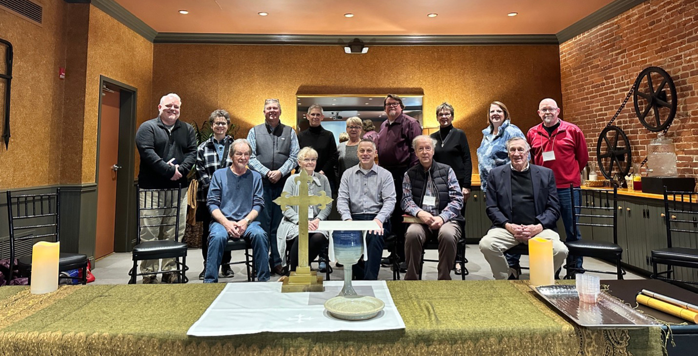 An image of diocese discernment committee members gathered together